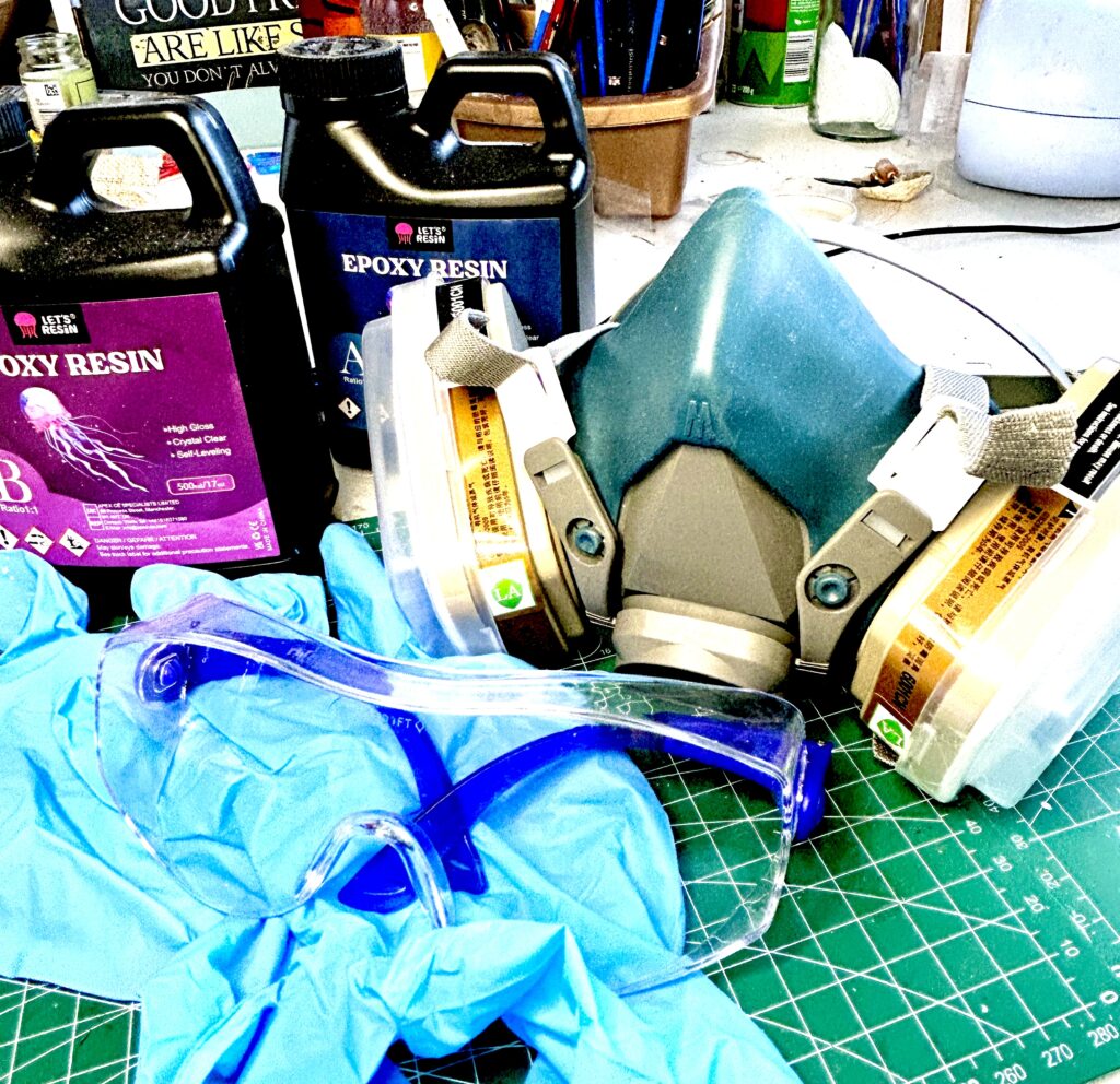 Epoxy resin safety setup including respirator mask, organic vapour filters, goggles  and nitrile gloves