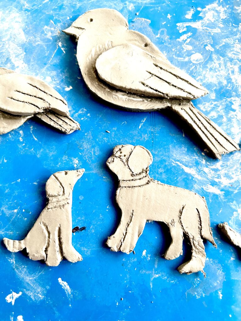 air dry clay pieces ready cut out in shapes of birds and dogs