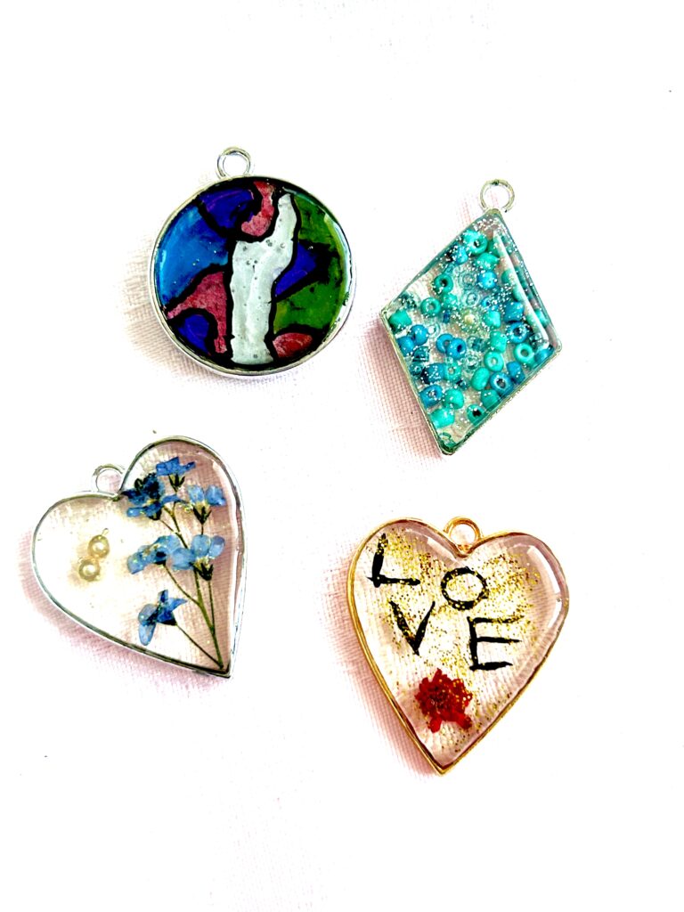 4 open back bezels with resin decoration