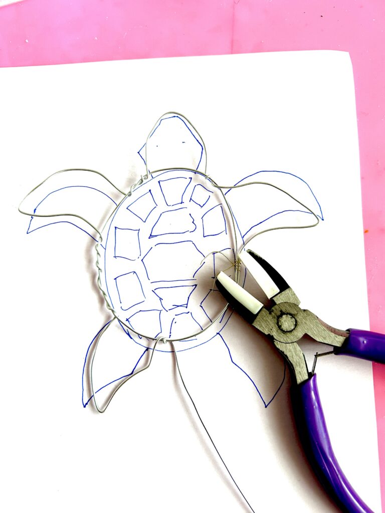 shaping wire on rough sketch - making a turtle suncatcher