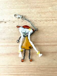 Wooden background for photographing handmade products such as my Mary-Anne Collection of Bag Charm characters 