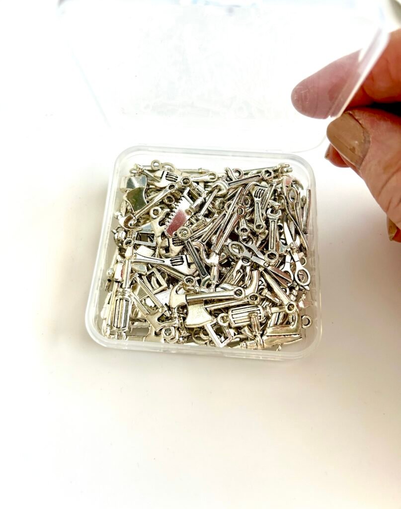 box of tiny silver tone DIY tools, used with DIY Kate Mary-Anne Collection Character Bag Charms