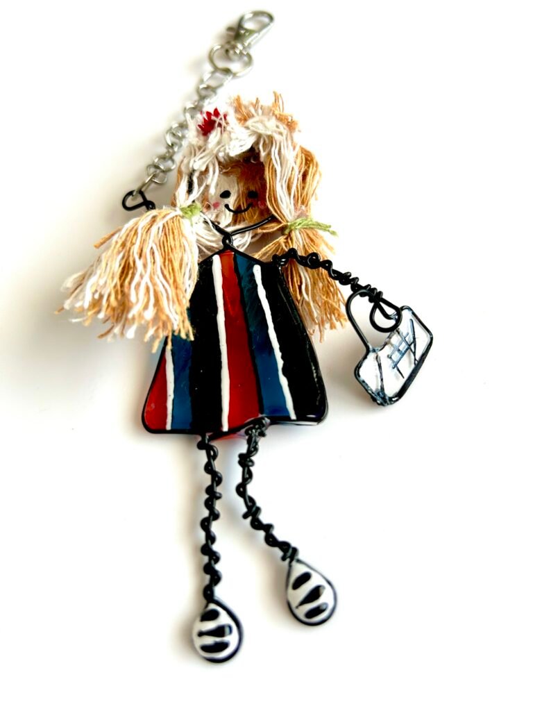 mary-anne collection character bag charm the girl loves accessories carrying a small handbag wearing a stripy dress and two tone hair style 