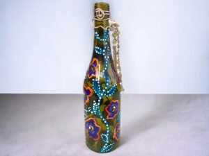 Decorative painted green wine bottle with added decoration with copper wire chains and gems 